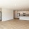 large room with wood flooring